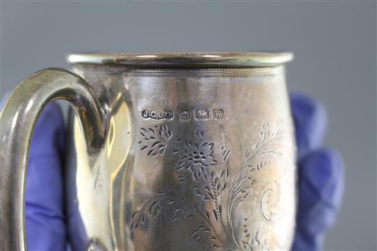 A pair of George V silver mugs, William Hair Haseler, Birmingham, 1935/7, height 85mm and one other smaller silver mug, 12.5oz,